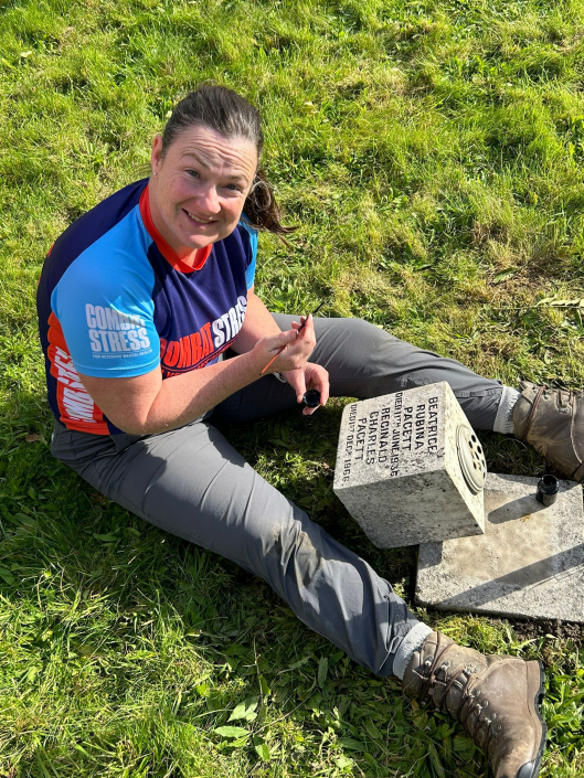Jenny working during the Veterans Grave Cleaning Weekend